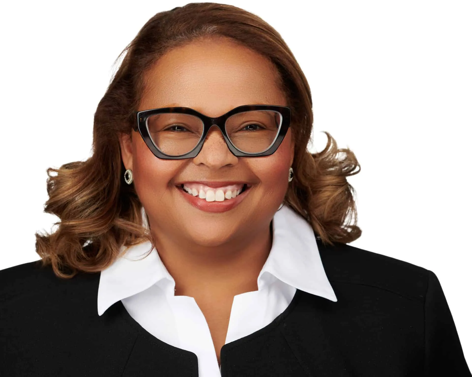 Professional headshot by Ben Marcum Photography of Black female executive with curly brown ombre hair styled in loose waves, large black cat-eye frame glasses, bright genuine smile showing white teeth, wearing black blazer with crisp white collared shirt on seamless white background, Louisville Kentucky business portrait photography