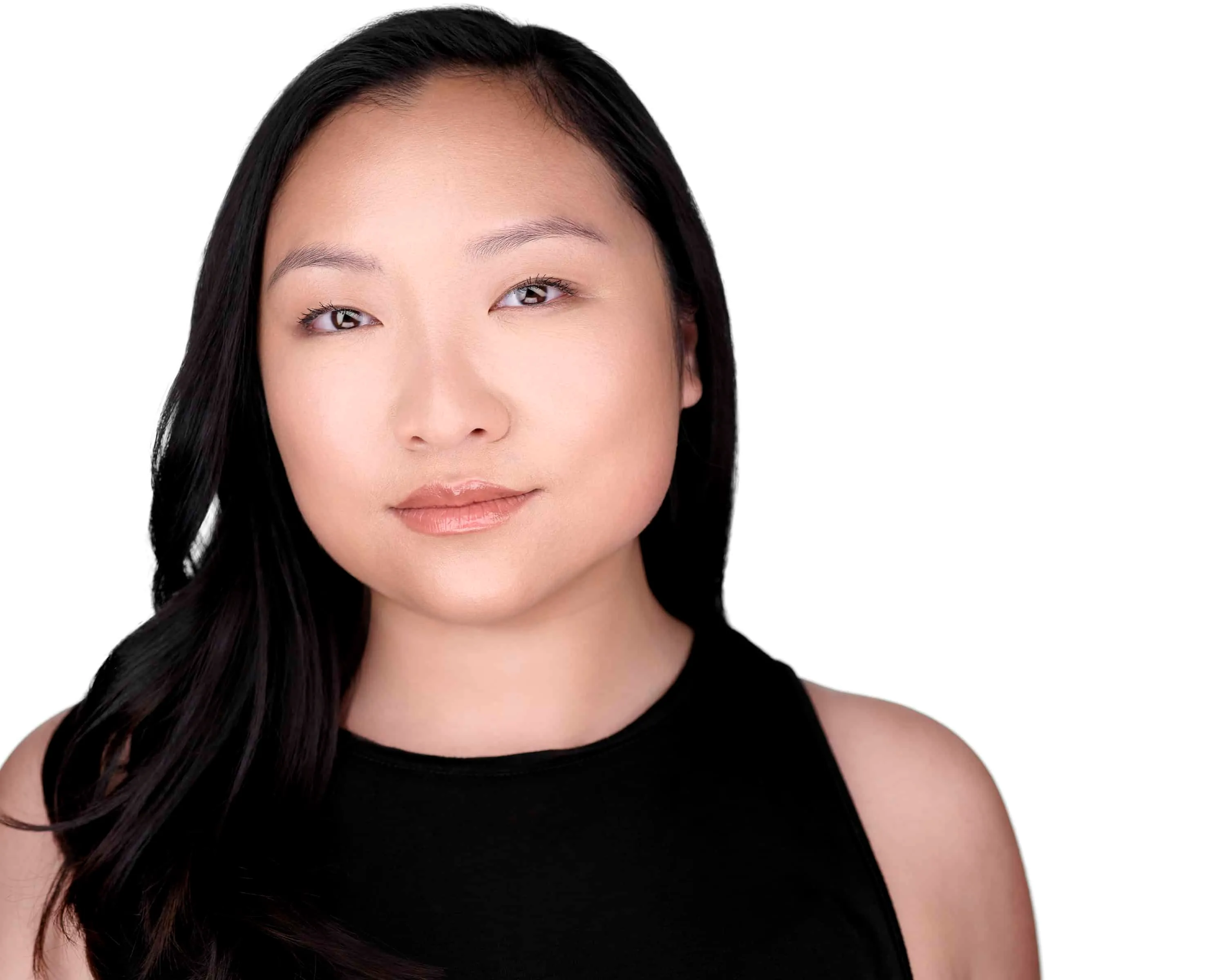 Asian female professional LinkedIn headshot with long straight black hair parted on side, natural makeup with nude lips, wearing black sleeveless top, photographed on seamless white background by Lancaster Pennsylvania headshot photographer Richard Waine, ideal business profile picture demonstrating approachability and professionalism