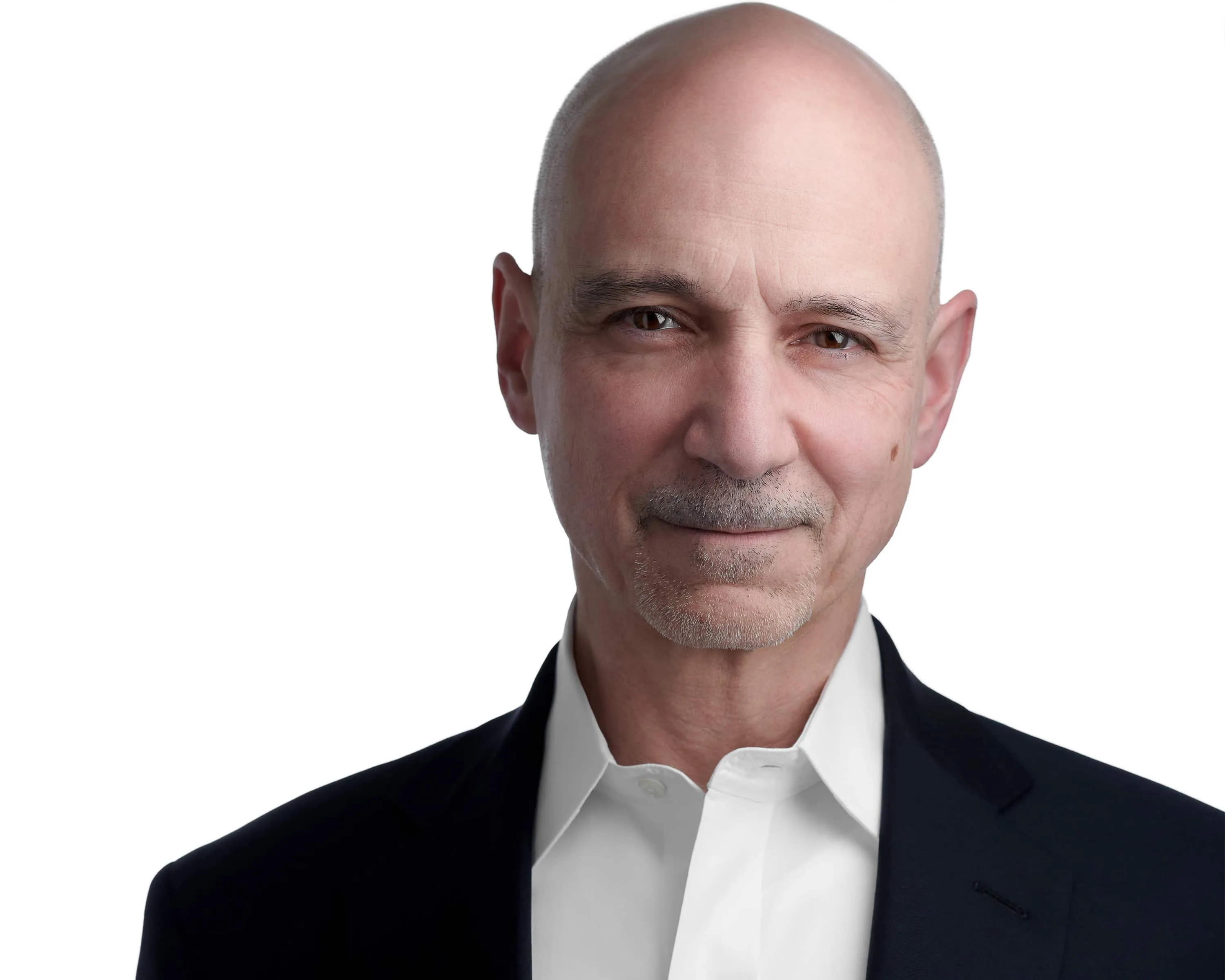 Professional headshot of male with bald head, grey goatee and facial hair, wearing black blazer over white collared dress shirt, photographed on seamless white background by Lancaster Pennsylvania headshot photographer Richard Waine