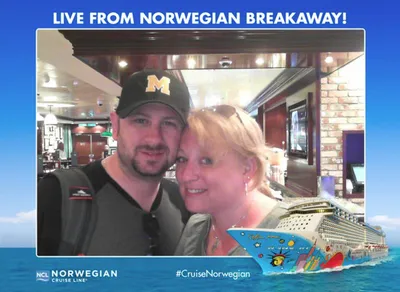 Photo of Richard Waine Lancaster Pennsylvania headshot photographer wearing black baseball cap with yellow M logo and black polo shirt with wife aboard Norwegian Breakaway cruise ship during Headshot Crewz professional photography conference trip to Bermuda 2016