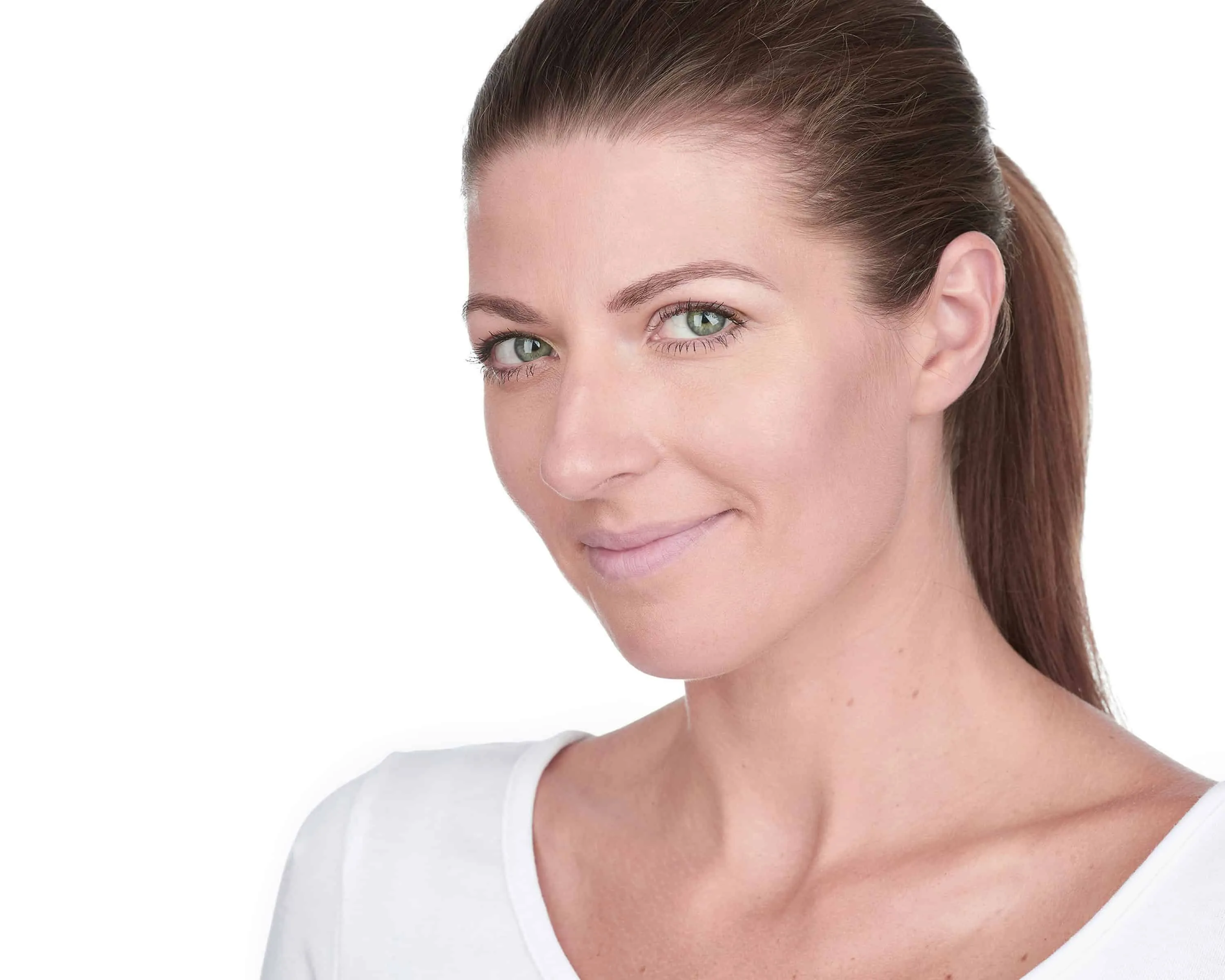 Woman with brown hair in sleek ponytail wearing white top against white studio background with warm smile